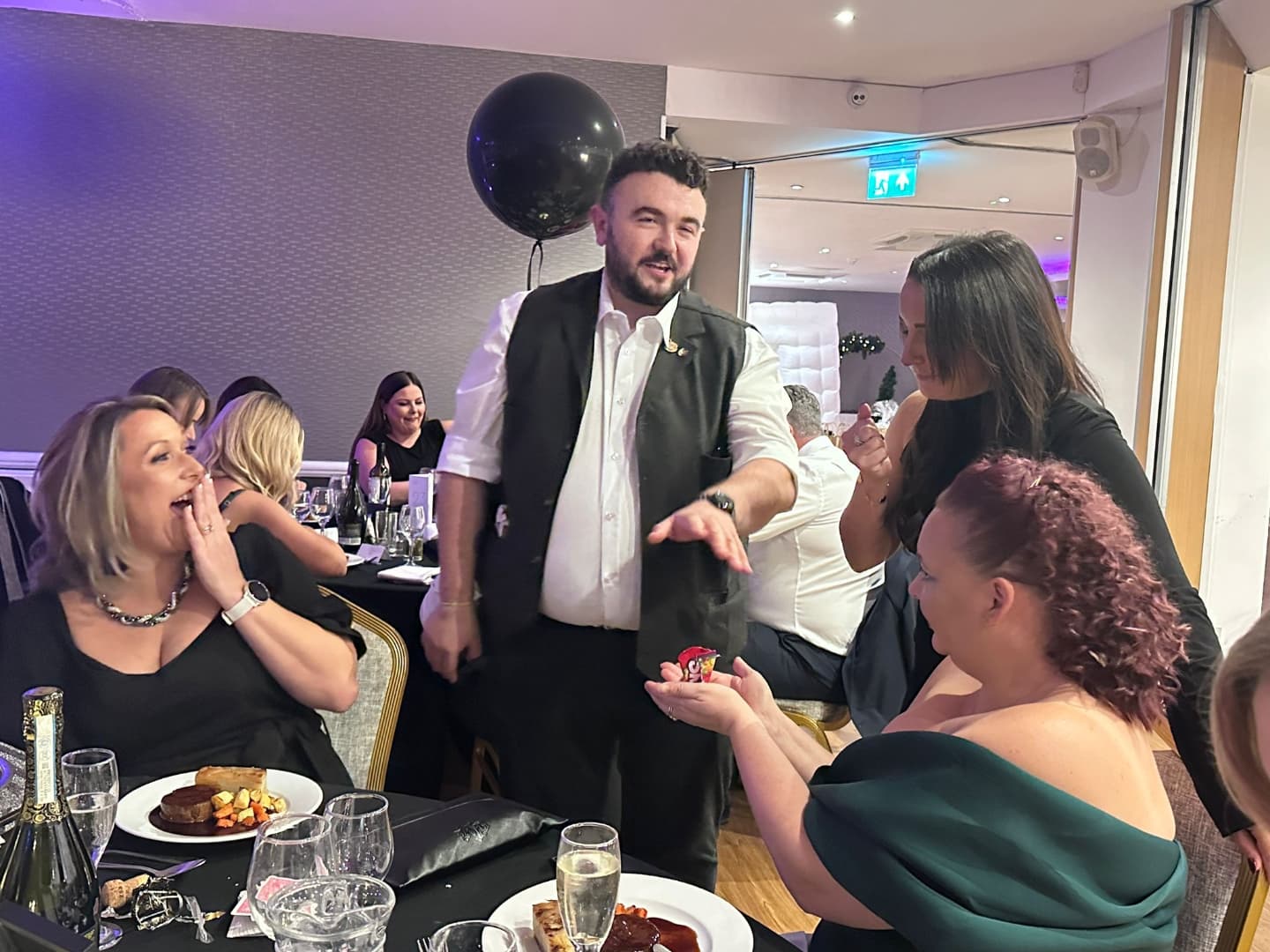 Great Gatsby magician entertaining guests at a themed event